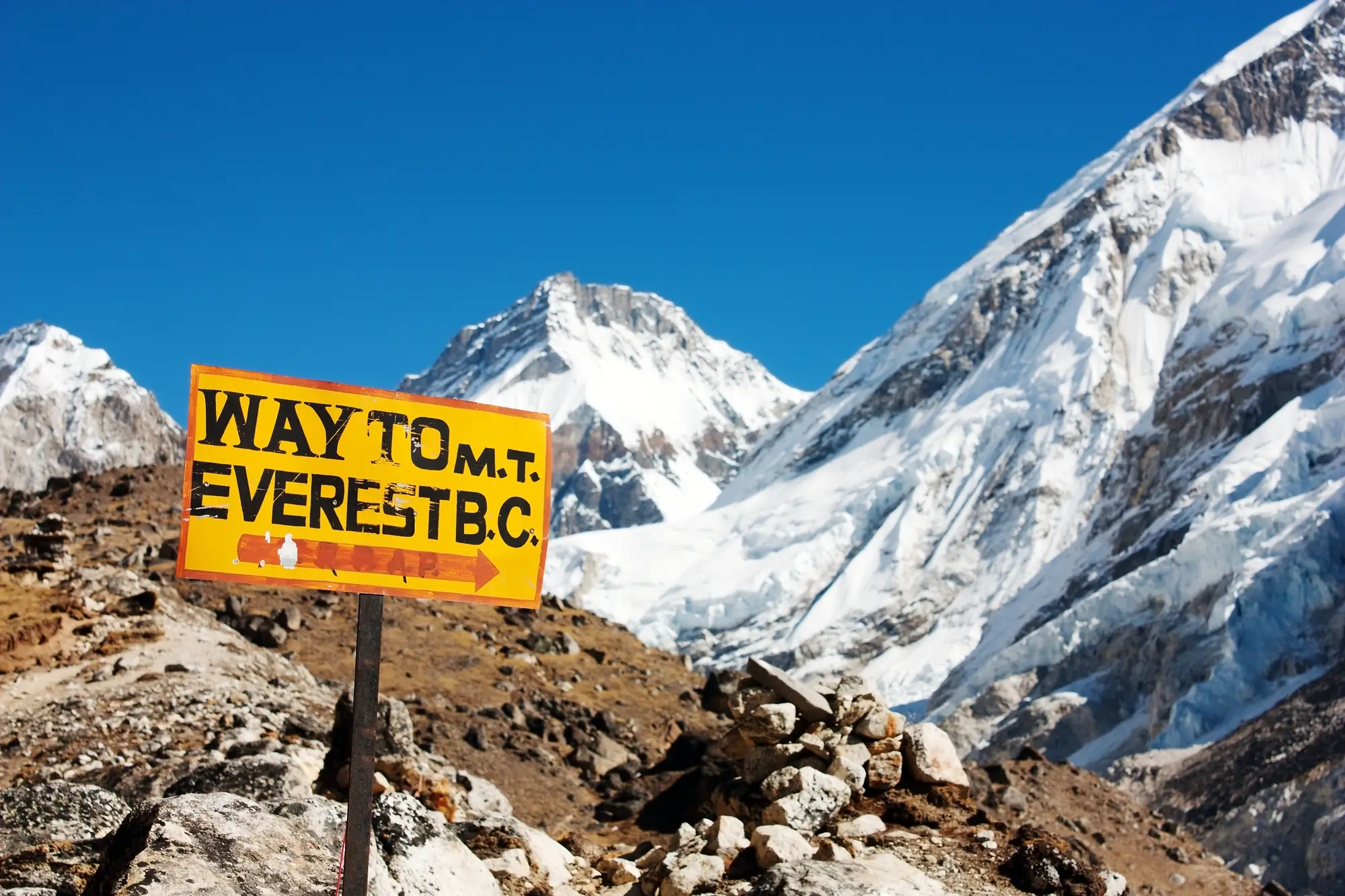 A sign with an arrow pointing right and a text WAY TO m.t. EVEREST B.C.