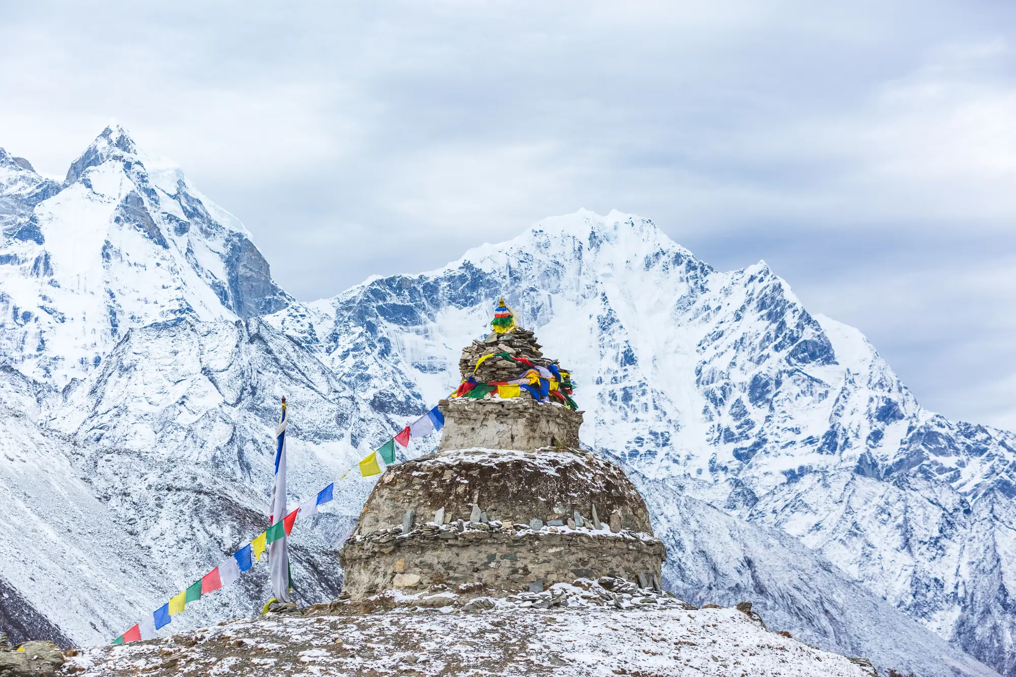 A view on the Himalayas with prayer flags