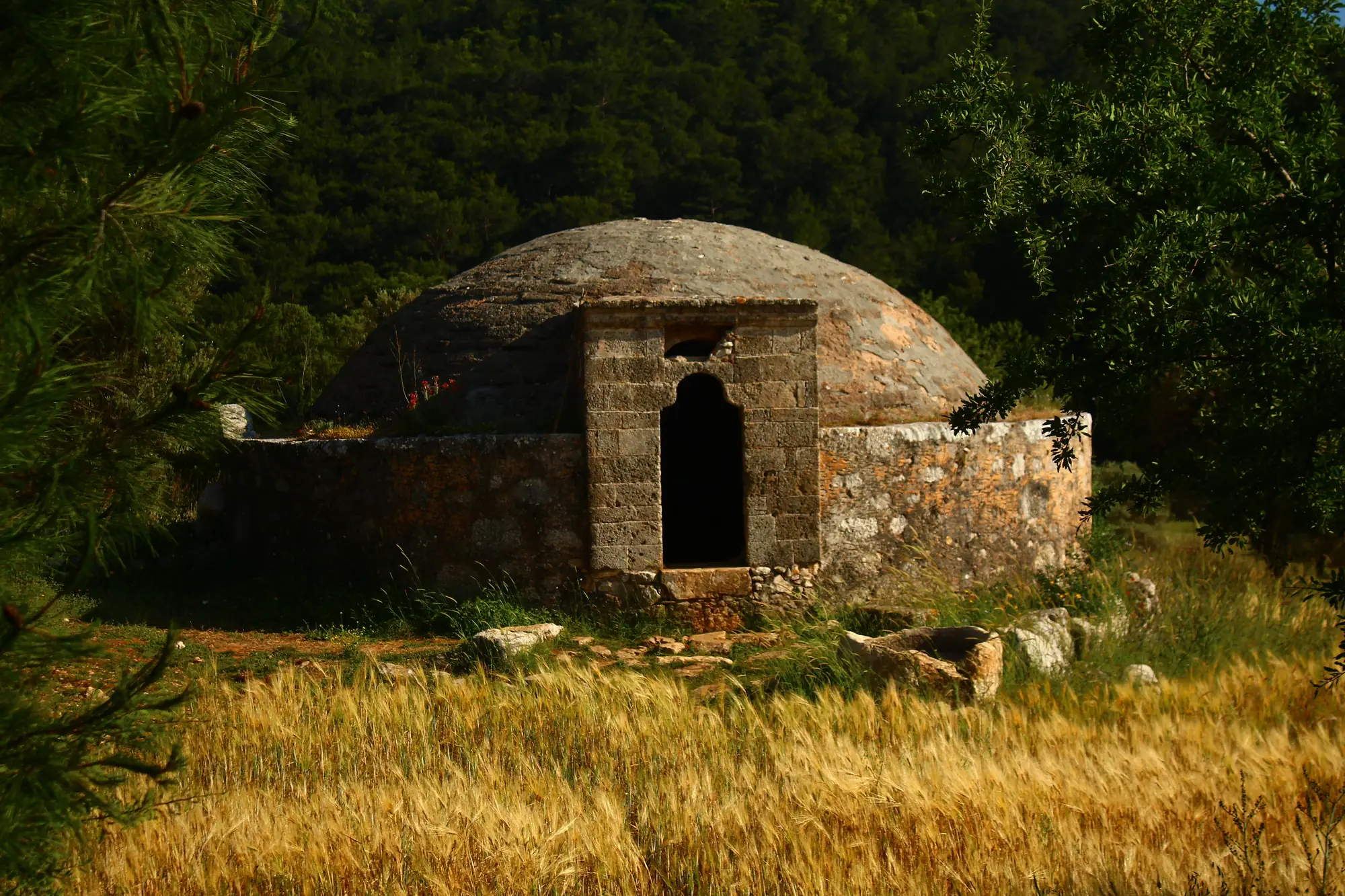 Ancient Lycian ruins with the greenery on the background